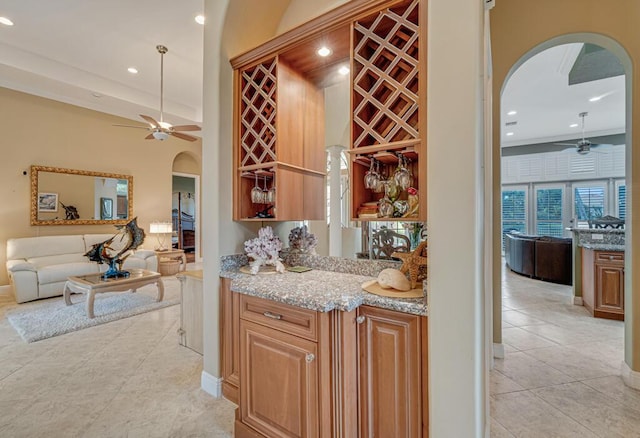 1885 Via Bellezza, Wellington, FL 33411 - bar with arched walkways, a ceiling fan, light tile patterned flooring, baseboards, and recessed lighting