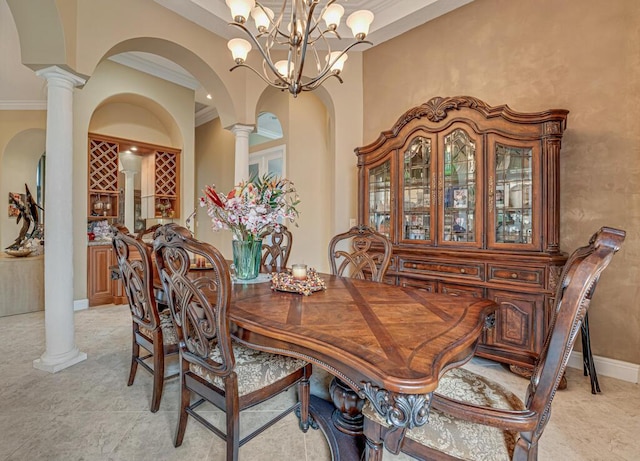1885 Via Bellezza, Wellington, FL 33411 - dining room with ornate columns, arched walkways, a chandelier, and ornamental molding