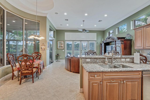 1885 Via Bellezza, Wellington, FL 33411 - kitchen featuring a sink, light stone countertops, a ceiling fan, dishwasher, and baseboards