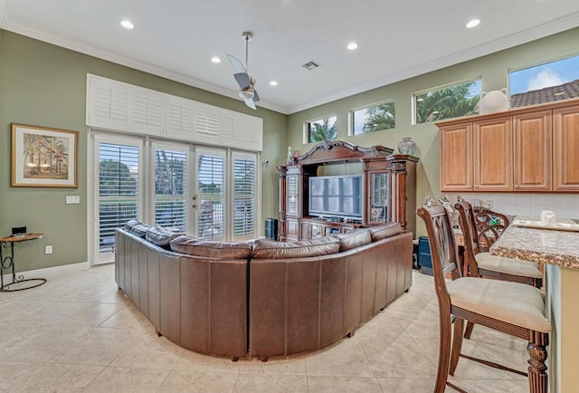 1885 Via Bellezza, Wellington, FL 33411 - living area with recessed lighting, light tile patterned flooring, crown molding, and baseboards