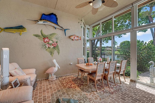 1885 Via Bellezza, Wellington, FL 33411 - sunroom featuring brick floors, a water view, plenty of natural light, and a textured wall