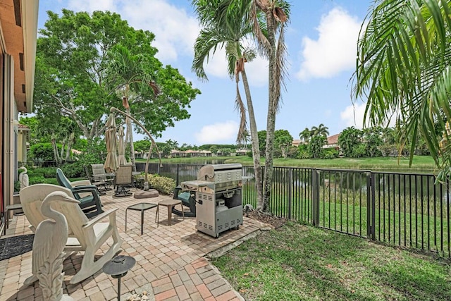 1885 Via Bellezza, Wellington, FL 33411 - view of patio with a water view and area for grilling