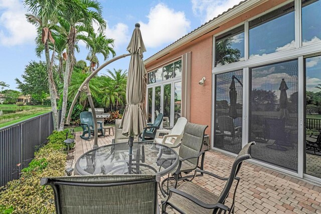 1885 Via Bellezza, Wellington, FL 33411 - view of patio featuring outdoor dining space