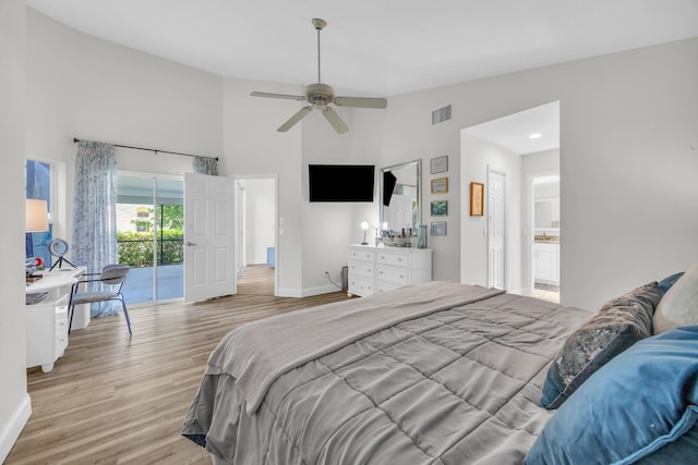 6304 SE Ames Way, Hobe Sound, FL 33455 - bedroom featuring light wood-style floors, baseboards, access to exterior, high vaulted ceiling, and a ceiling fan