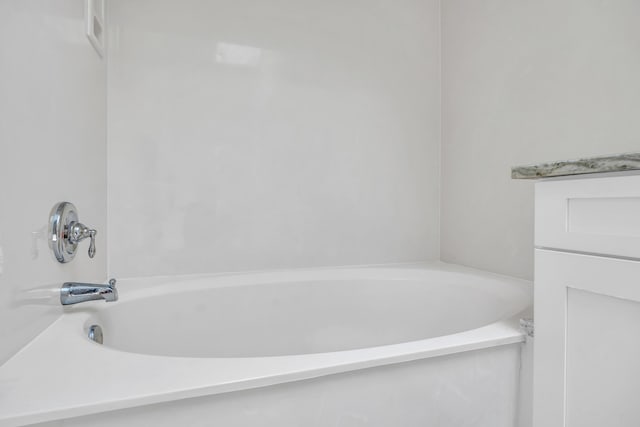 6304 SE Ames Way, Hobe Sound, FL 33455 - bathroom featuring a tub to relax in