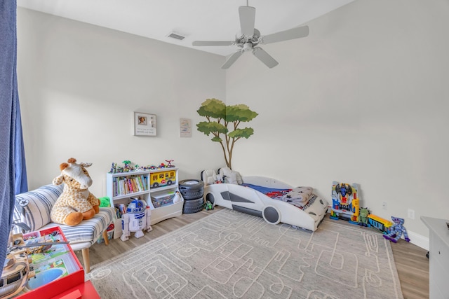 6304 SE Ames Way, Hobe Sound, FL 33455 - game room with wood finished floors, ceiling fan, and baseboards