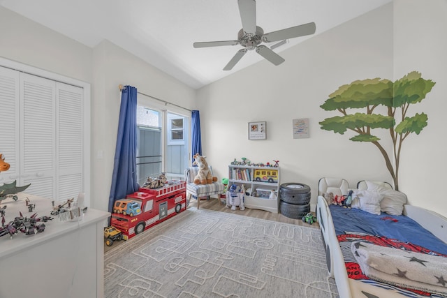 6304 SE Ames Way, Hobe Sound, FL 33455 - bedroom featuring vaulted ceiling, wood finished floors, a ceiling fan, and a closet