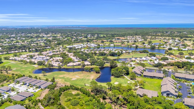 6304 SE Ames Way, Hobe Sound, FL 33455 - aerial overview of property's location featuring a large body of water, nearby suburban area, and a golf course