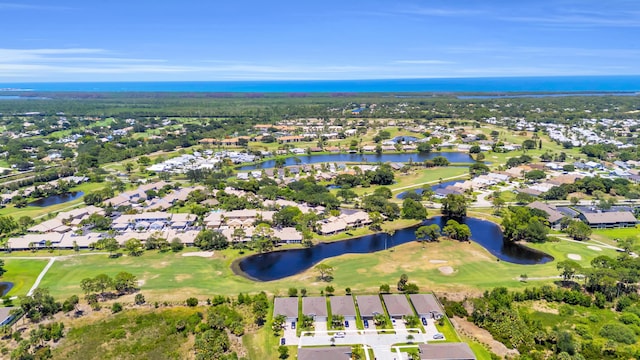 6304 SE Ames Way, Hobe Sound, FL 33455 - aerial view of property and surrounding area with nearby suburban area, a local golf course, and a large body of water