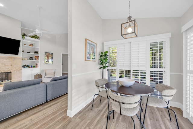 6304 SE Ames Way, Hobe Sound, FL 33455 - dining room featuring baseboards, wood finished floors, ceiling fan, and a high ceiling