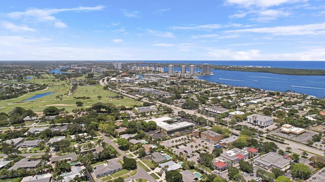 744 Eastwind Dr, North Palm Beach, FL 33408 - aerial view of property and surrounding area with a nearby body of water, a golf course, and nearby suburban area