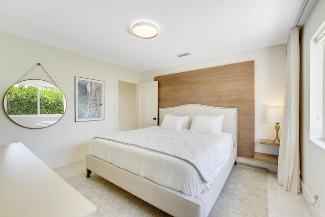 744 Eastwind Dr, North Palm Beach, FL 33408 - bedroom with light carpet and baseboards