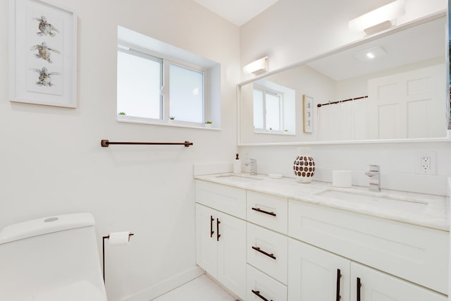 744 Eastwind Dr, North Palm Beach, FL 33408 - full bath with double vanity, toilet, baseboards, and curtained shower