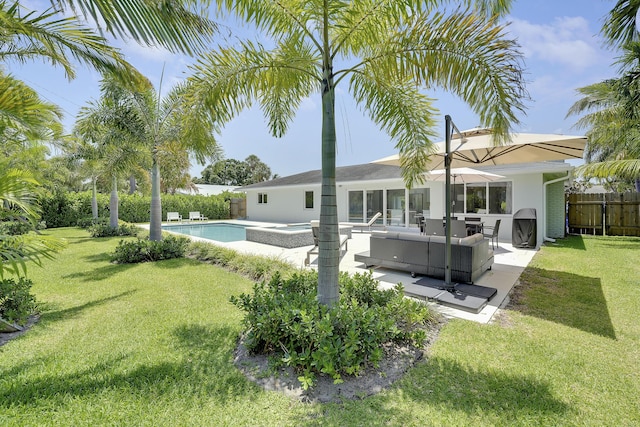 744 Eastwind Dr, North Palm Beach, FL 33408 - rear view of house featuring an outdoor living space, a patio, stucco siding, and an in-ground hot tub
