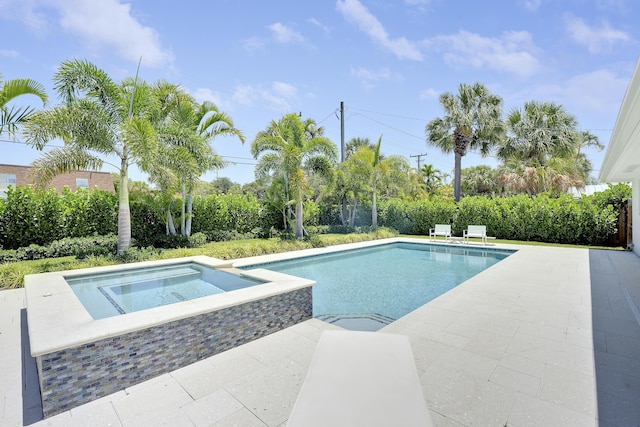 744 Eastwind Dr, North Palm Beach, FL 33408 - view of swimming pool featuring an in-ground hot tub and a patio area