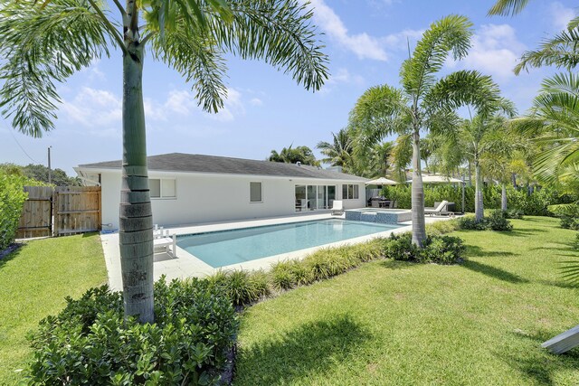 744 Eastwind Dr, North Palm Beach, FL 33408 - view of pool featuring a patio area and a pool with connected hot tub