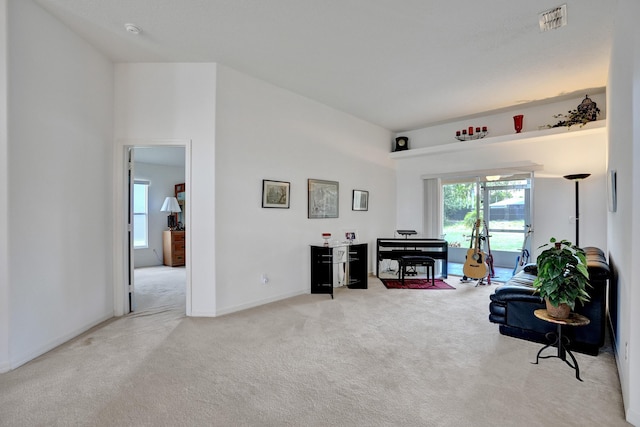 5940 NW Center St, Port Saint Lucie, FL 34986 - living area featuring light carpet and baseboards
