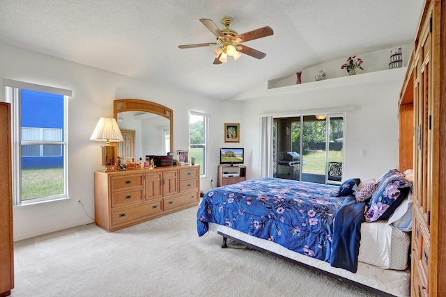 5940 NW Center St, Port Saint Lucie, FL 34986 - carpeted bedroom featuring access to outside, vaulted ceiling, multiple windows, and ceiling fan