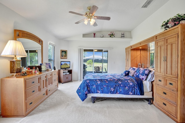 5940 NW Center St, Port Saint Lucie, FL 34986 - bedroom with light colored carpet, access to outside, lofted ceiling, multiple windows, and a ceiling fan