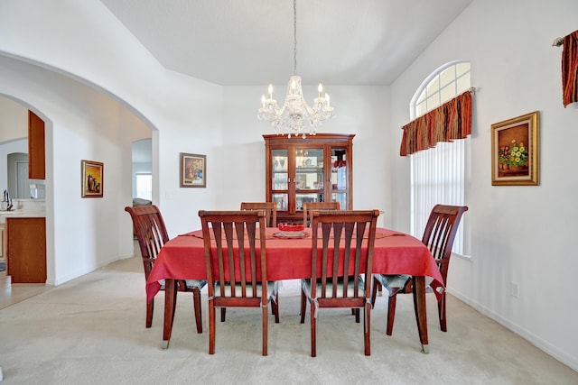 5940 NW Center St, Port Saint Lucie, FL 34986 - dining room featuring plenty of natural light, light carpet, and a chandelier