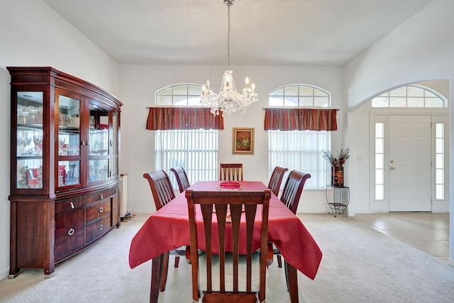5940 NW Center St, Port Saint Lucie, FL 34986 - carpeted dining room featuring a chandelier