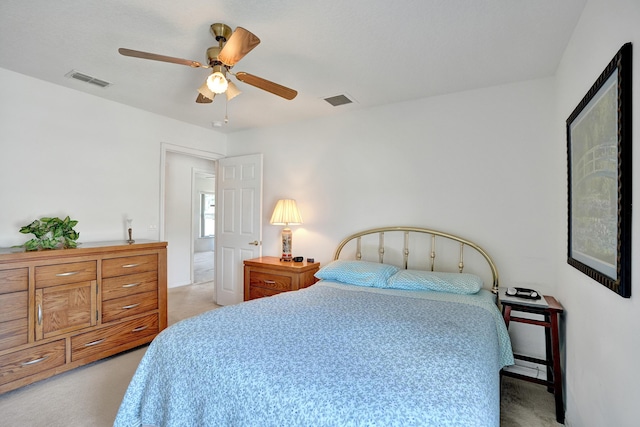 5940 NW Center St, Port Saint Lucie, FL 34986 - bedroom with light carpet and a ceiling fan