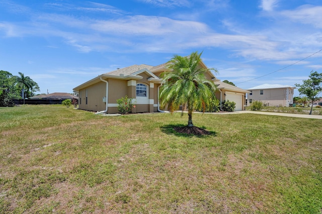 5940 NW Center St, Port Saint Lucie, FL 34986 - ranch-style house with driveway, a front yard, a garage, and stucco siding