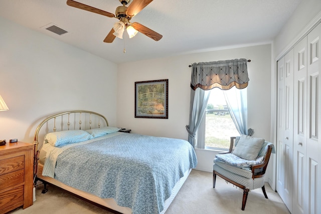 5940 NW Center St, Port Saint Lucie, FL 34986 - bedroom featuring light colored carpet, a closet, and ceiling fan