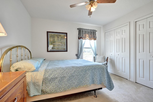 5940 NW Center St, Port Saint Lucie, FL 34986 - bedroom with multiple closets, light carpet, and ceiling fan