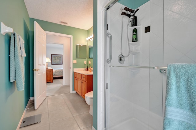5940 NW Center St, Port Saint Lucie, FL 34986 - bathroom featuring a shower stall, vanity, tile patterned floors, and a textured ceiling