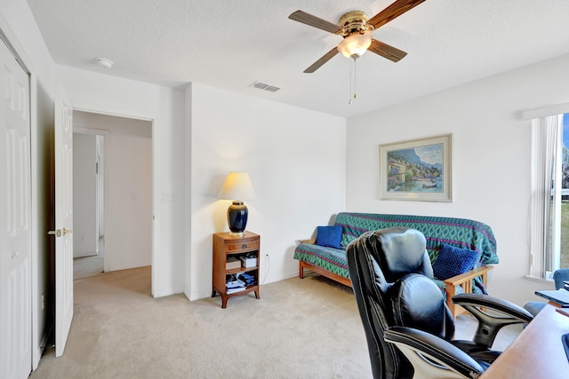 5940 NW Center St, Port Saint Lucie, FL 34986 - office area featuring a ceiling fan, light colored carpet, plenty of natural light, and a textured ceiling