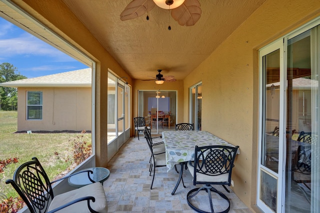 5940 NW Center St, Port Saint Lucie, FL 34986 - sunroom / solarium with a ceiling fan, outdoor dining area, and healthy amount of natural light