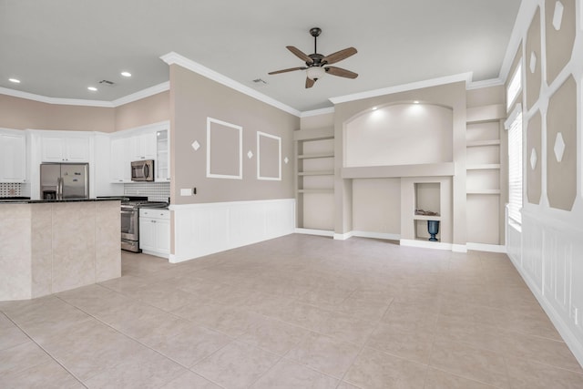 198 Magnolia Lakes Blvd, Port Saint Lucie, FL 34986 - unfurnished living room with ceiling fan, built in shelves, ornamental molding, recessed lighting, and light tile patterned floors
