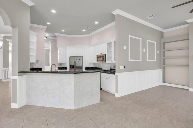 198 Magnolia Lakes Blvd, Port Saint Lucie, FL 34986 - kitchen featuring appliances with stainless steel finishes, light tile patterned floors, crown molding, backsplash, and recessed lighting