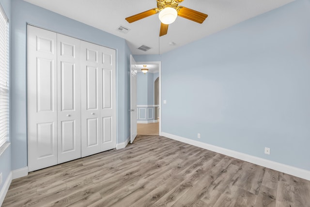 198 Magnolia Lakes Blvd, Port Saint Lucie, FL 34986 - unfurnished bedroom with a closet, wood finished floors, baseboards, and ceiling fan