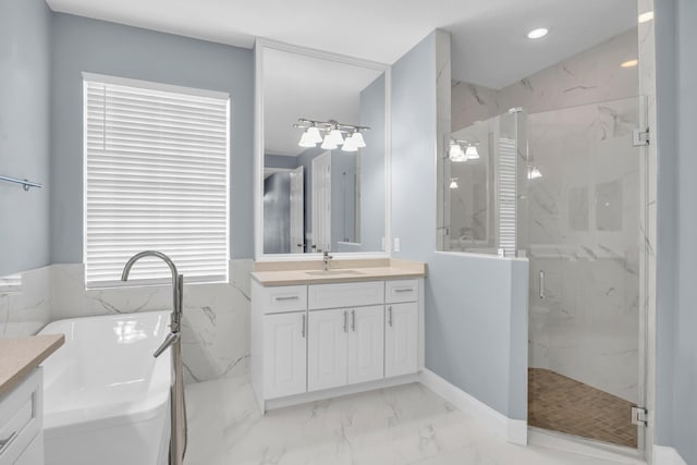 198 Magnolia Lakes Blvd, Port Saint Lucie, FL 34986 - full bath with vanity, a marble finish shower, a soaking tub, marble finish floors, and recessed lighting
