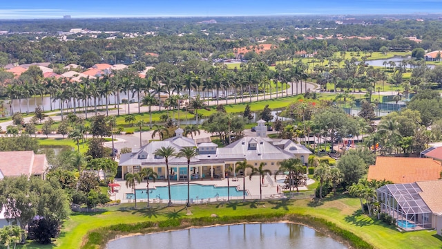 198 Magnolia Lakes Blvd, Port Saint Lucie, FL 34986 - aerial perspective of suburban area with a pool and a nearby body of water