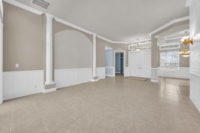 198 Magnolia Lakes Blvd, Port Saint Lucie, FL 34986 - spare room with a decorative wall, light tile patterned flooring, ornate columns, ornamental molding, and wainscoting