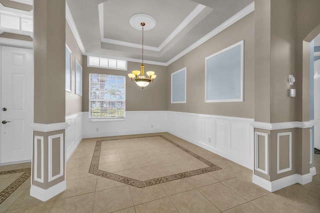198 Magnolia Lakes Blvd, Port Saint Lucie, FL 34986 - unfurnished dining area featuring crown molding, wainscoting, a tray ceiling, and a chandelier