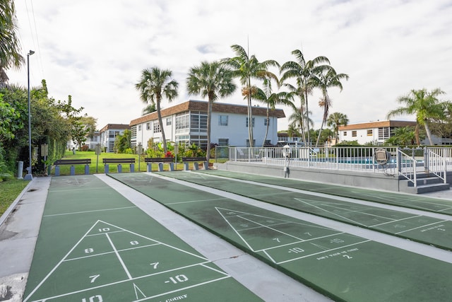 2950 SE Ocean Blvd Unit 9-5, Stuart, FL 34996 - view of property's community with shuffleboard and a swimming pool