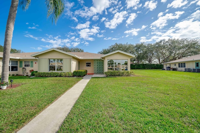 14240 Nesting Way Unit D, Delray Beach, FL 33484 - ranch-style house with a front yard and stucco siding