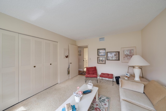 14240 Nesting Way Unit D, Delray Beach, FL 33484 - carpeted living area with a textured ceiling