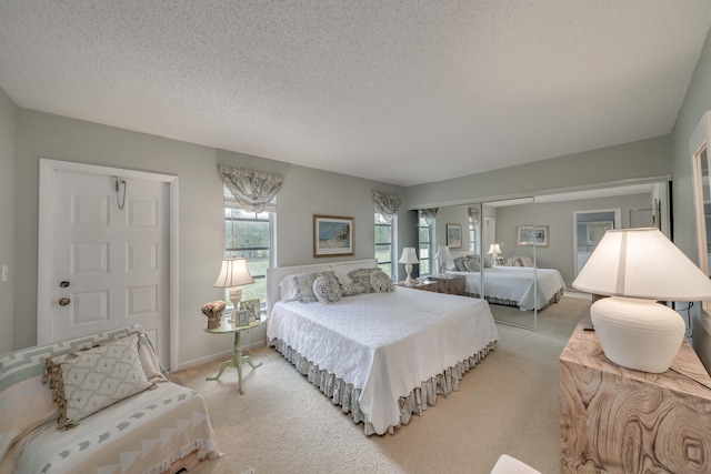 14240 Nesting Way Unit D, Delray Beach, FL 33484 - bedroom with light carpet and a textured ceiling