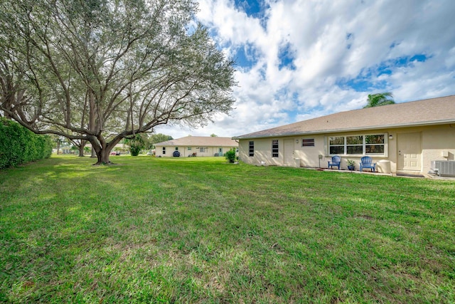 14240 Nesting Way Unit D, Delray Beach, FL 33484 - view of grassy yard with central air condition unit