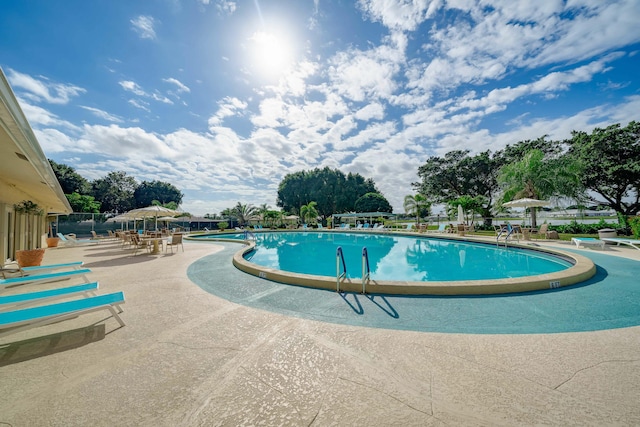 14240 Nesting Way Unit D, Delray Beach, FL 33484 - community pool featuring a patio