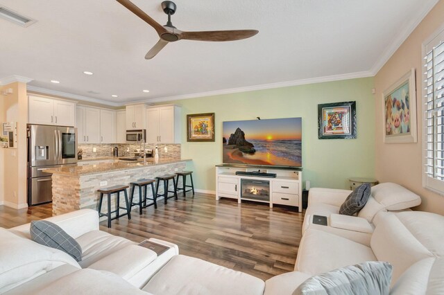 5014 Manchia Dr, Lake Worth, FL 33463 - living area with ceiling fan, dark wood-style flooring, ornamental molding, recessed lighting, and baseboards