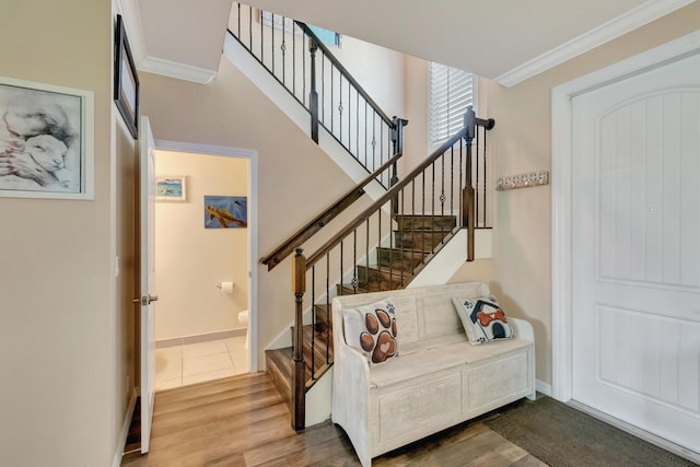 5014 Manchia Dr, Lake Worth, FL 33463 - stairway featuring ornamental molding, wood finished floors, and baseboards