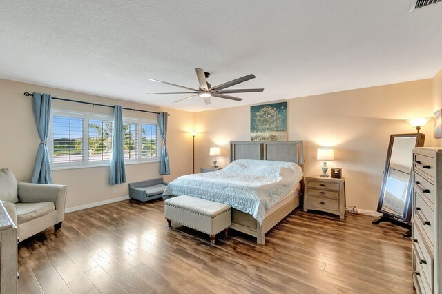 5014 Manchia Dr, Lake Worth, FL 33463 - bedroom featuring baseboards, wood finished floors, and a ceiling fan