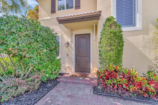 5014 Manchia Dr, Lake Worth, FL 33463 - doorway to property featuring stucco siding