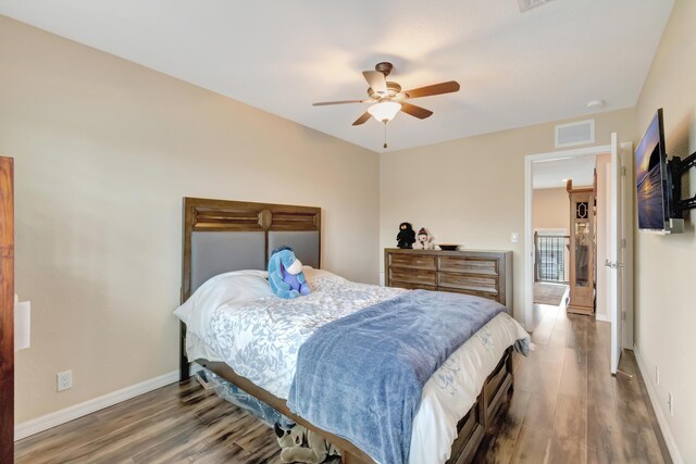 5014 Manchia Dr, Lake Worth, FL 33463 - bedroom with wood finished floors, baseboards, and a ceiling fan